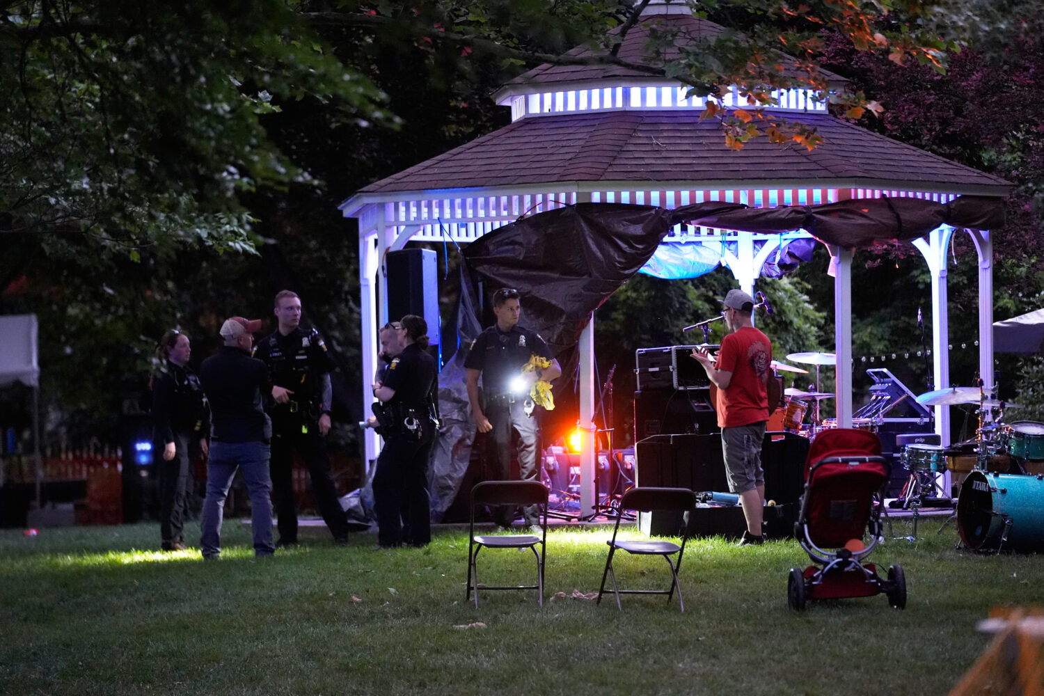 FILE - Police investigate where multiple people were shot at a community festival at Agnes Reynolds...