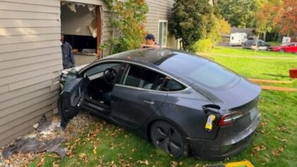car crashes into tesla Redmond apartment...