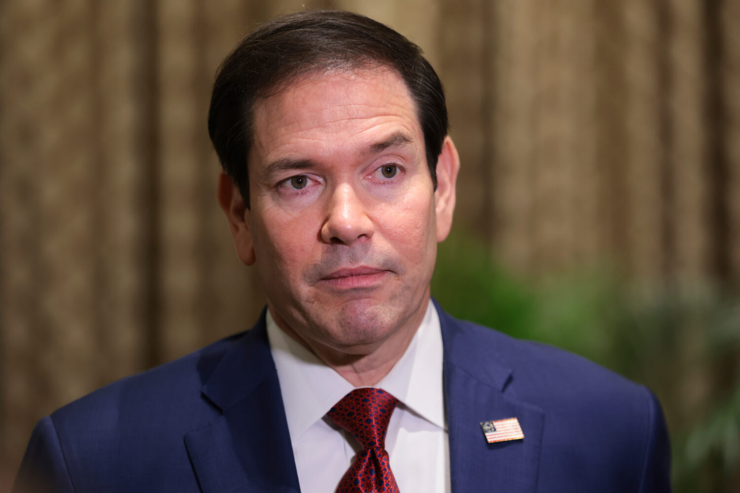 U.S. Secretary of State Marco Rubio looks on as he speaks with members of the media at the Taj Maha...