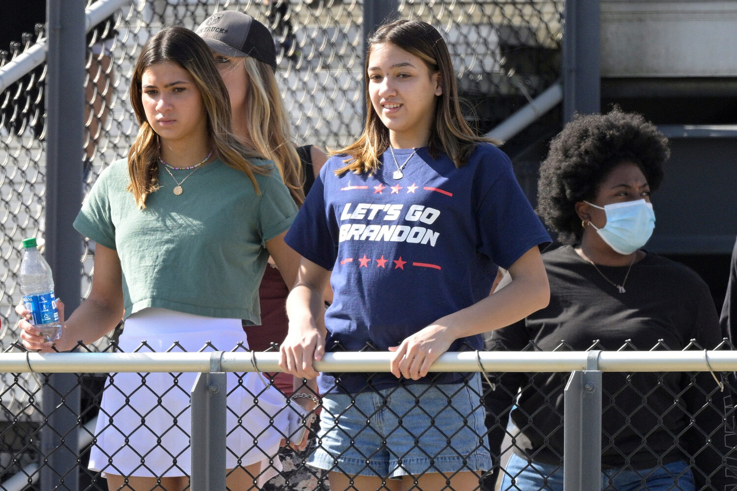 FILE - A spectator wears a Let's Go Brandon shirt in the stands during the first half of the Hula B...