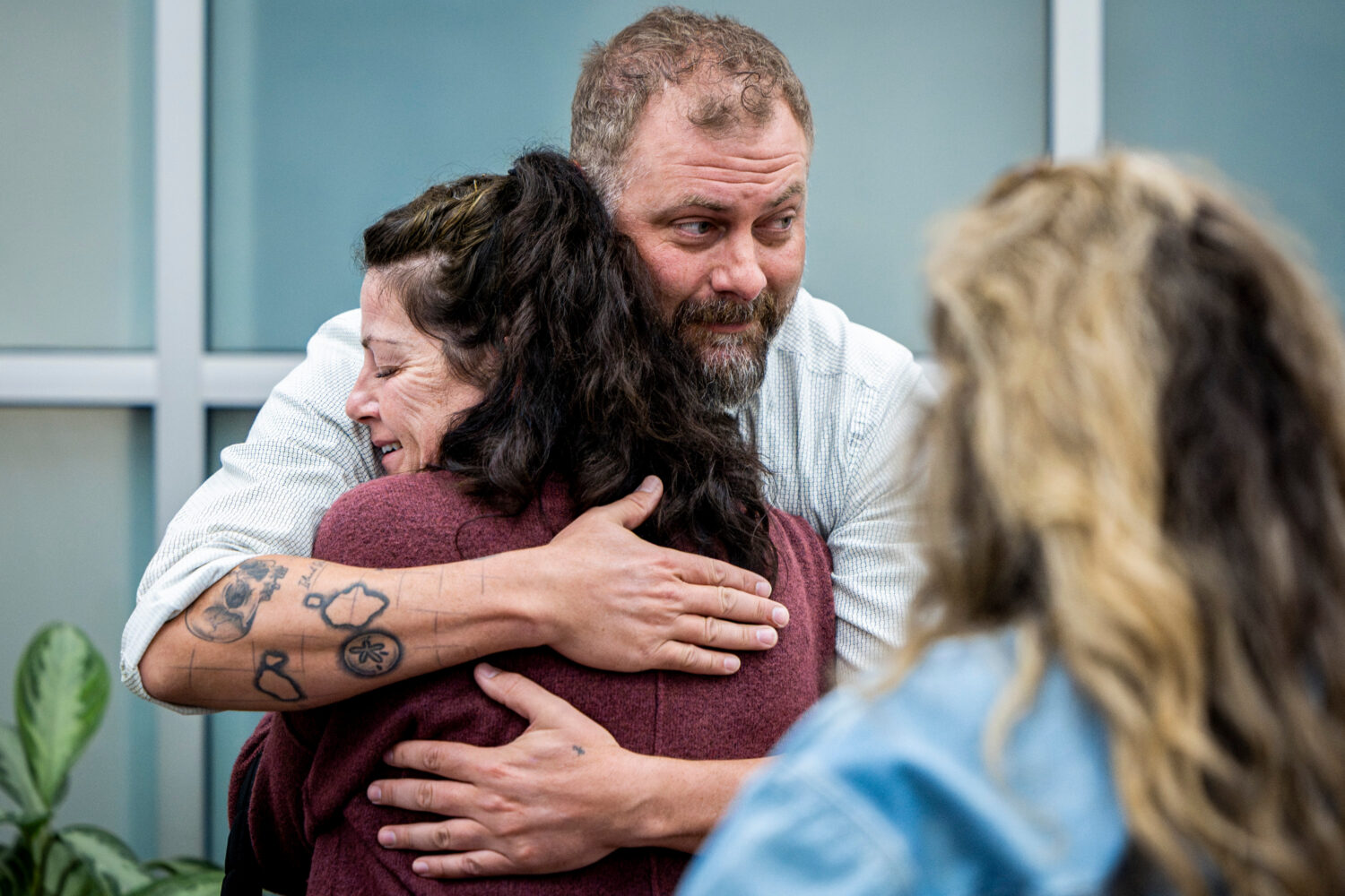 FILE - Utah County Sheriff's Deputy Jake Hall, lead detective on the case, hugs Tommi Aime, the you...