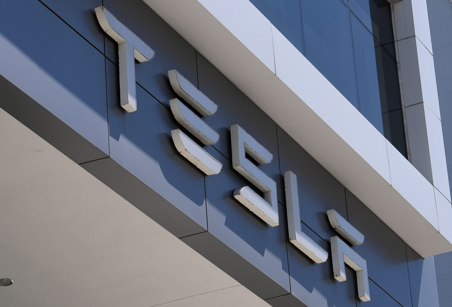 FILE - The Tesla logo is displayed at a Tesla dealership Thursday, Mar. 13, 2025, in Miami. (AP Pho...