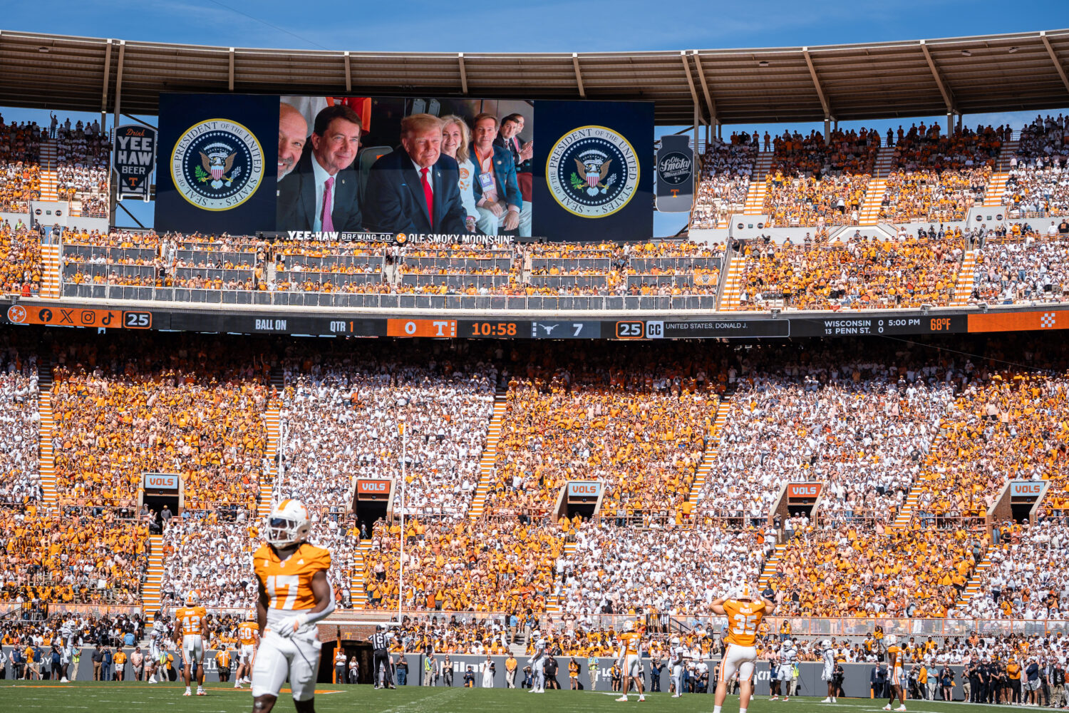 President Donald Trump is displayed on the scoreboard as he attends the Tennessee-Texas NCAA colleg...