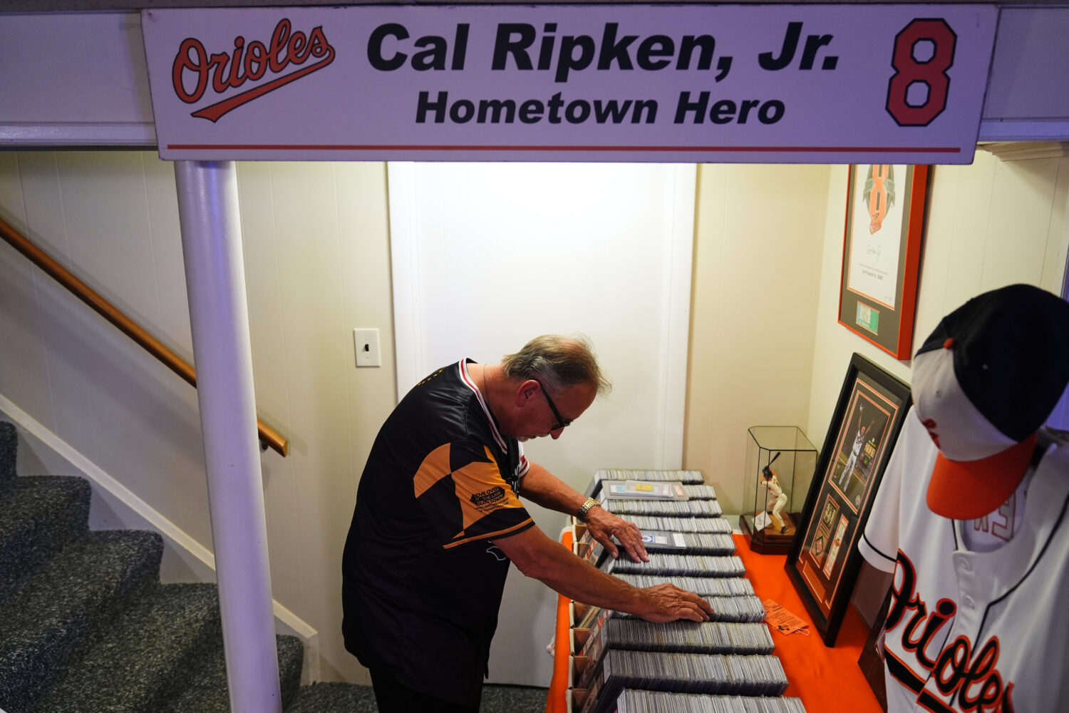 Baltimore Orioles fan Rick Taylor looks through his collection of tickets from almost every basebal...