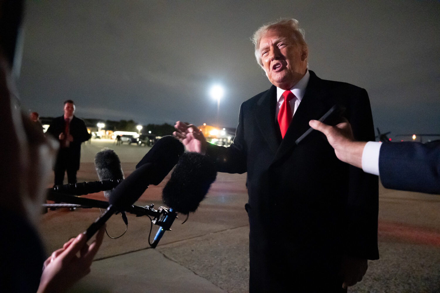 President Donald Trump speaks with reporters as he arrives on Air Force One, Saturday, Oct. 10, 202...