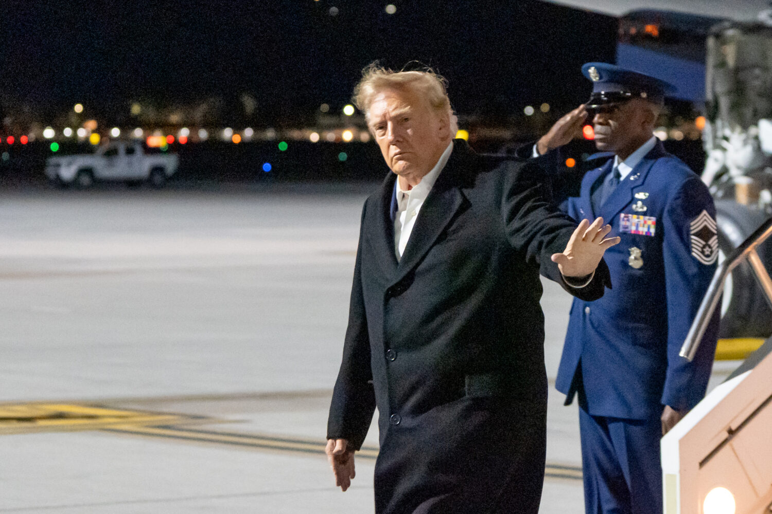 President Donald Trump waves as he arrives at Harry Reid International Airport, Wednesday, Oct. 14,...