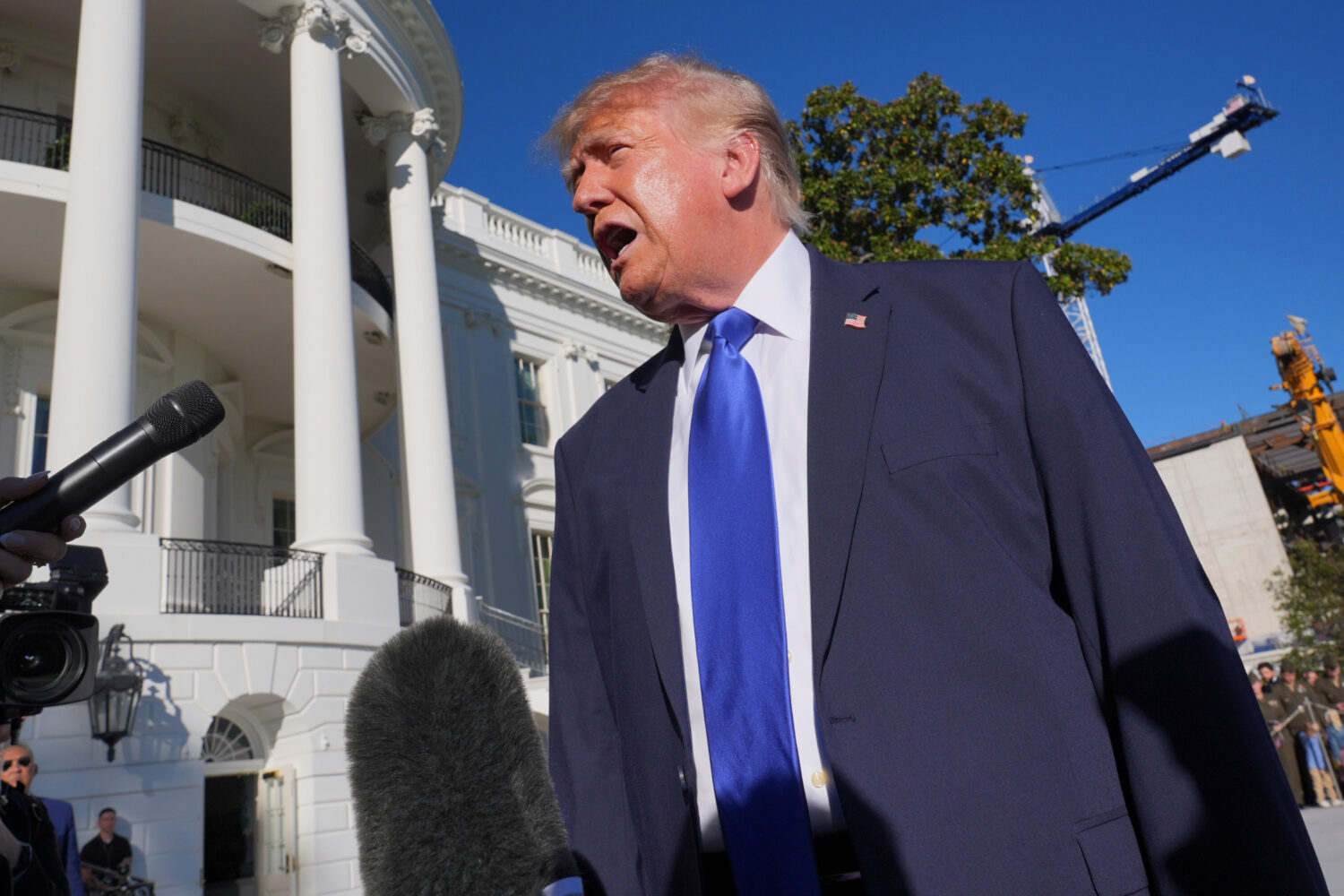 President Donald Trump speaks to reporters before walking to board Marine One on the South Lawn of ...