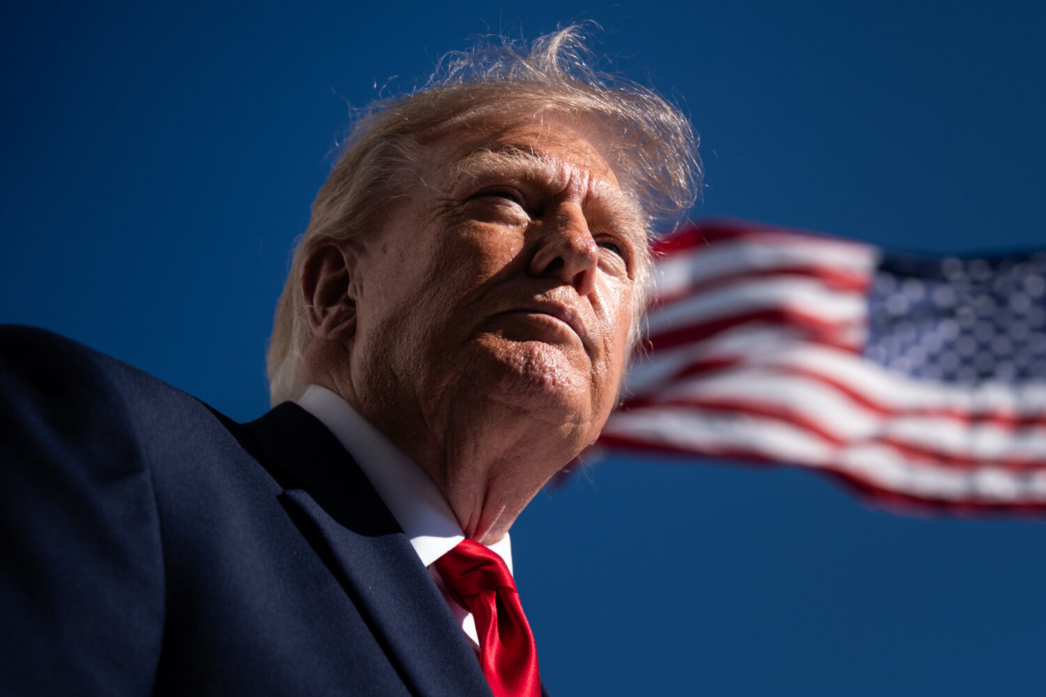 President Donald Trump speaks with reporters before boarding Marine One on the South Lawn of the Wh...