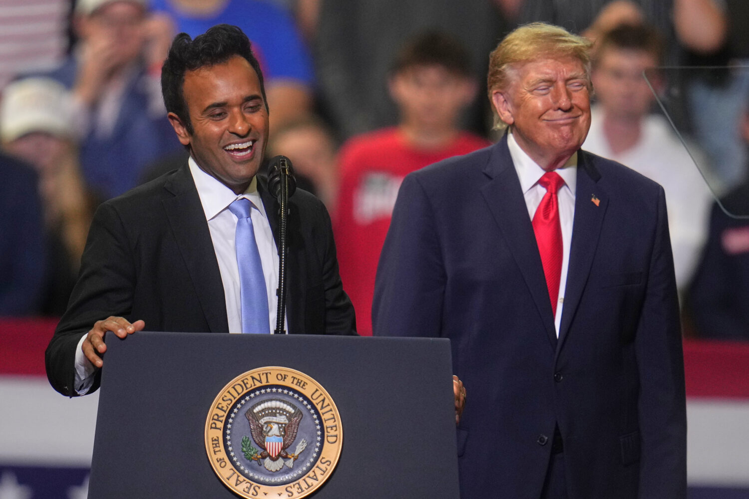 President Donald Trump listens a gubernatorial candidate Vivek Ramaswamy speaks at a campaign rally...