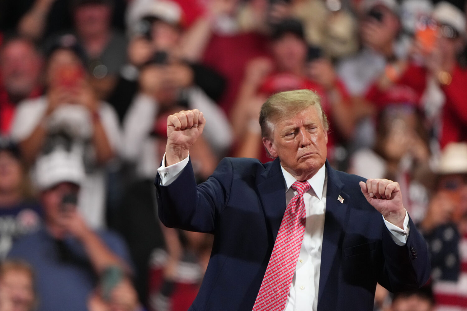 President Donald Trump dances at a campaign rally at Heartland Credit Union Arena, Monday, Oct. 19,...