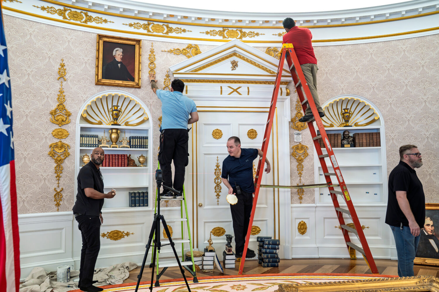 A replica of President Donald Trump's Oval Office is updated to the current decor by workers at "Th...