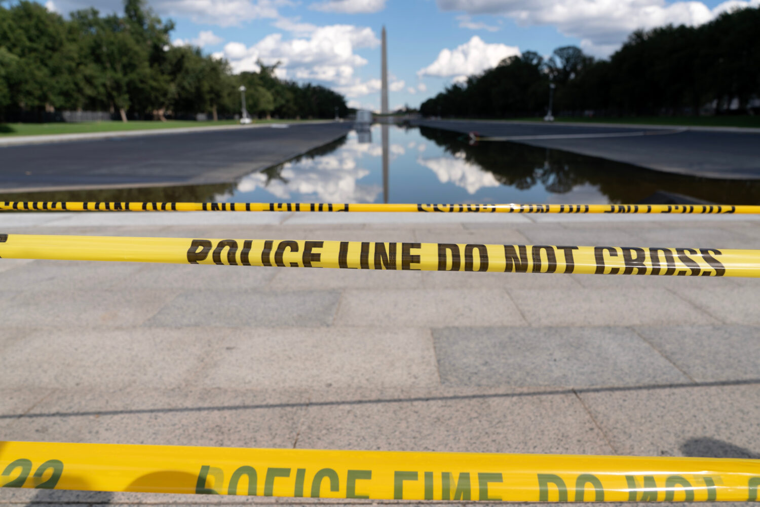 FILE - The Lincoln Memorial Reflecting Pool is seen with police line yellow tape at the National Ma...