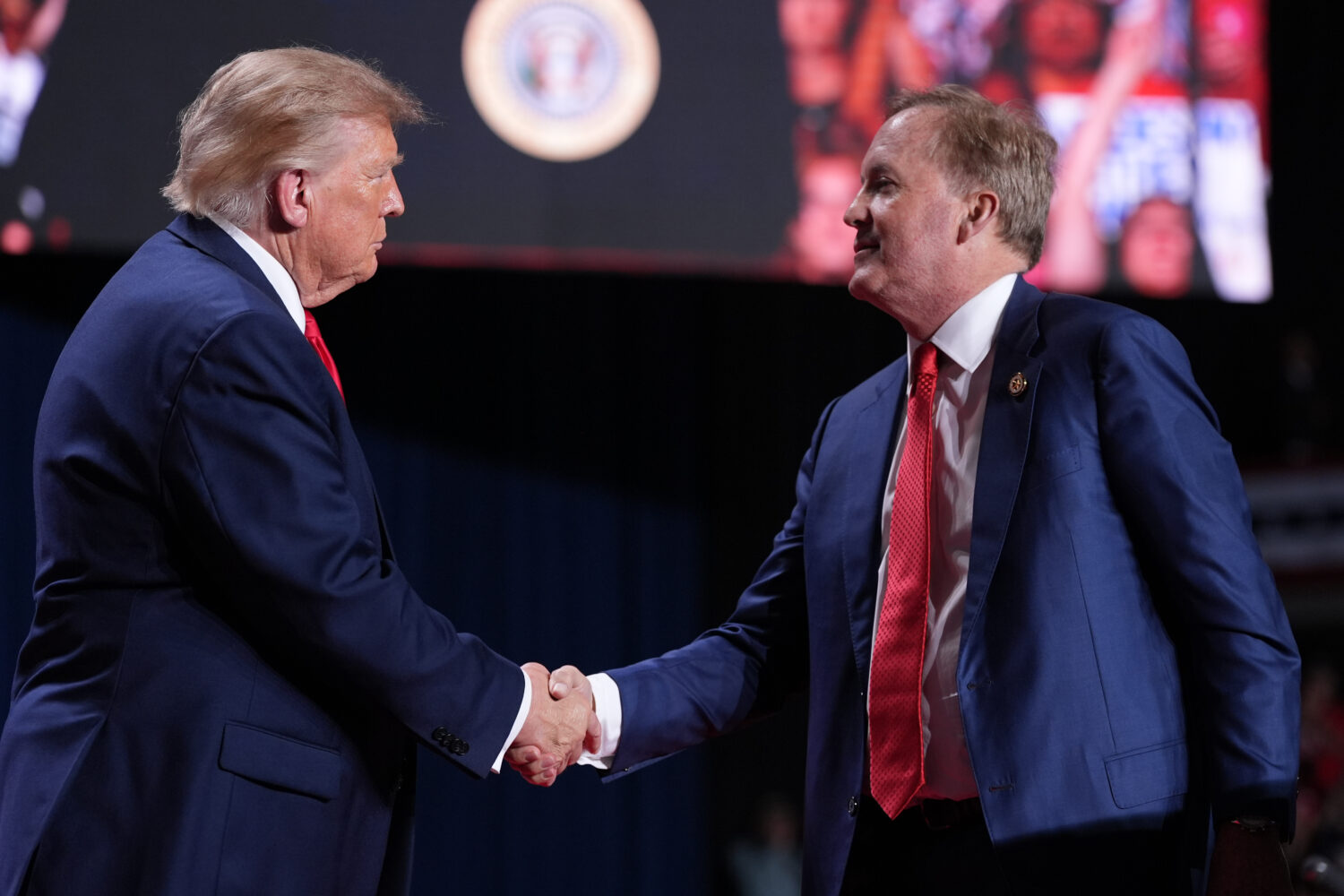 President Donald Trump greets Republican U.S. Senate candidate Texas Attorney General Ken Paxton at...