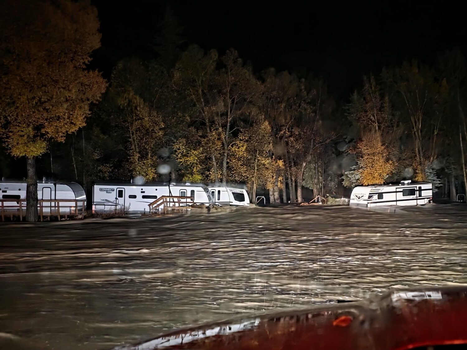 Floodwaters surround trailers at the Fun Valley Family Resort campground and RV part in South Fork,...