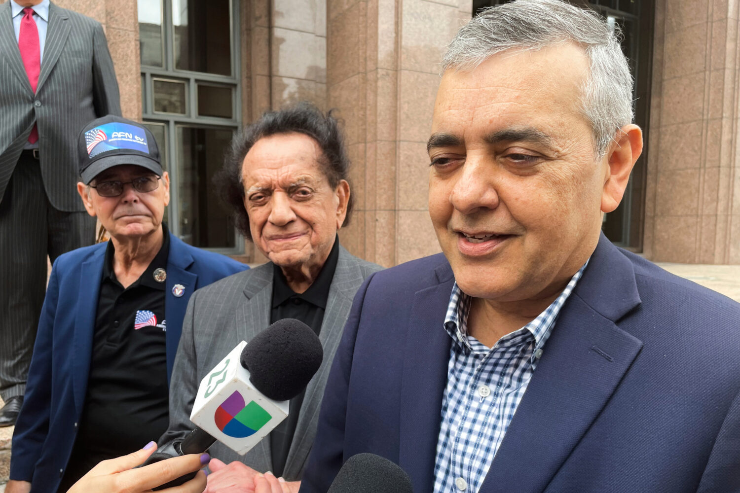 FILE - Former U.S. Rep. David Rivera speaks with media outside a federal court in Miami, Dec. 20, 2...
