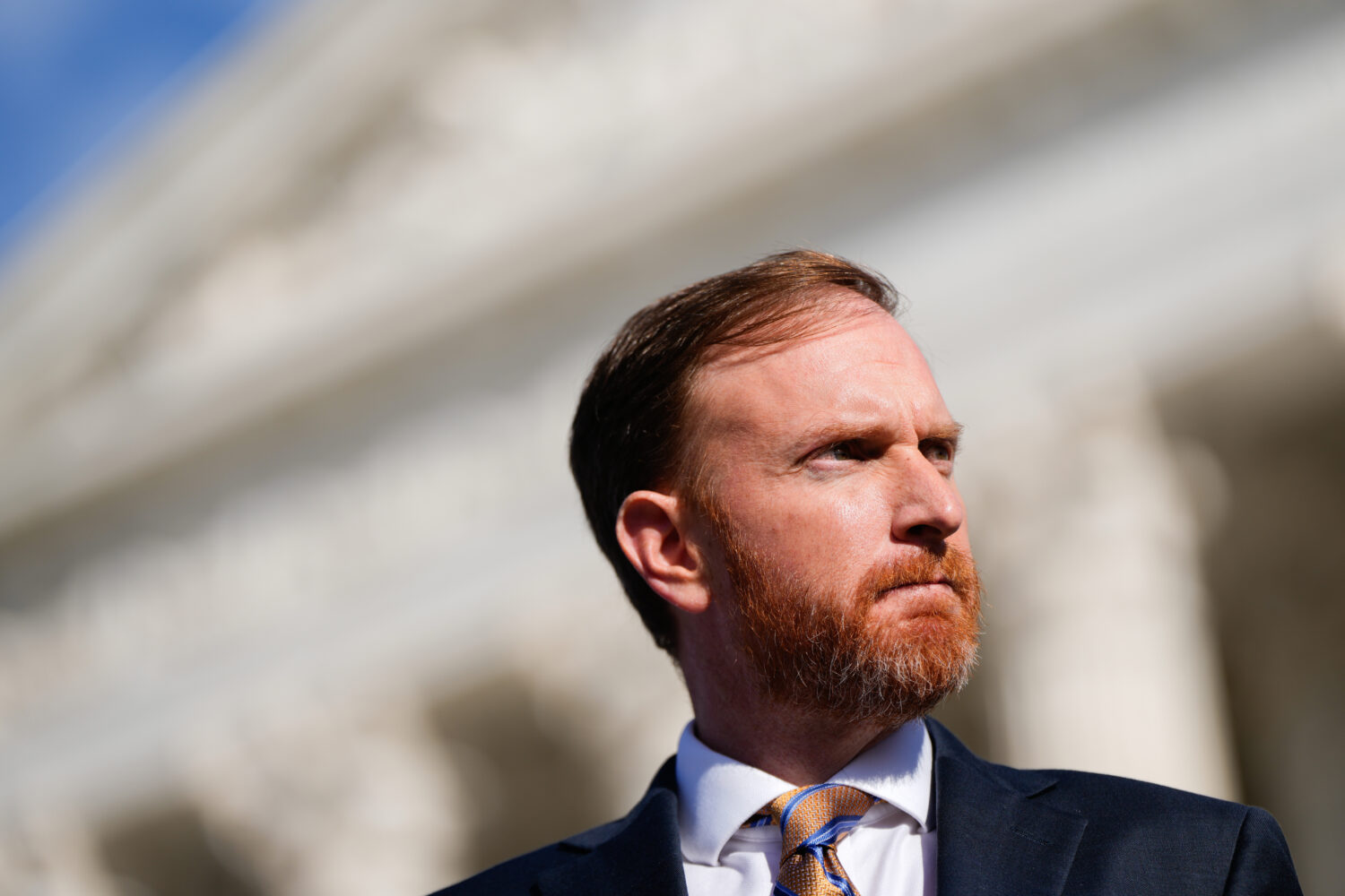 FILE - West Virginia Attorney General John McCuskey stands outside the Supreme Court after oral arg...