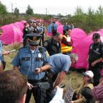 Seattle police enter the Nickelsville protest area in 2008.