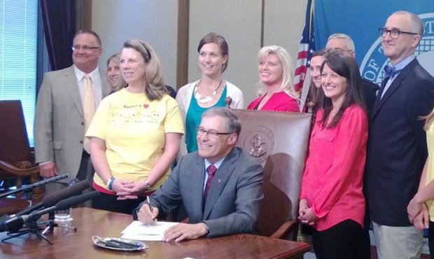 Governor Inslee signs SHB 1556 into law requiring all Washington state high school students to rece...