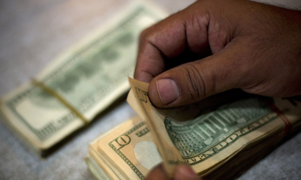 The Fed is so confident about the economy it won’t have to print so much money. (AP Photo/Fil...