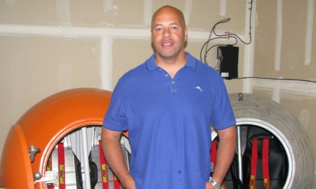 (Chris Sullivan/KIRO Radio) Julian Sharpe stands next to his prototype tsunami capsule and the one ...