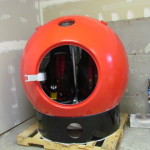 The first completed tsunami capsule sits in IDEA International's Mukilteo parking garage before delivery.
