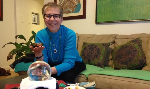 Robyn Fritz sits with Fallon, her crystal ball, in Rachel Belle’s living room. (Photo by Rach...