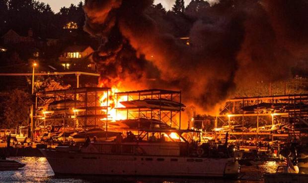 A fire Thursday night destroyed 14 boats at a storage facility on Northlake Way in Seattle on Lake ...