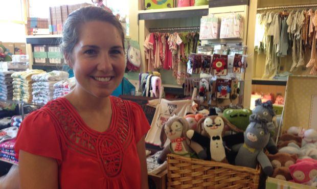 Anna Williams stands by Bla Bla dolls in her store Village Maternity. She says the dolls are hand k...