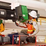 Workers do tests on Big Bertha before she heads underground.