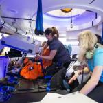 Boeing engineers with Astronaut Randy Bresnik inside the seven-person capsule.