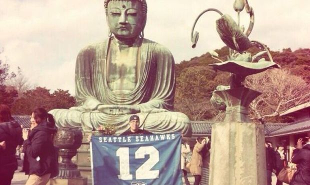 A Port Orchard man takes his autographed 12th Man Flag on trips with him so he can “represent...