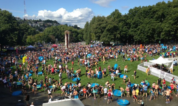 Participants have a great time throwing thousands of water balloons at each other during one of the...