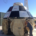 Boeing has spent the last few days dunking its eight-person, 14,000-pound space capsule into a giant tank of water to test the airbag system that will deploy when the capsule returns from low Earth orbit.