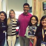 11-year-old Nicole Christensen and her family pose with Russell Wilson and his wife Ashton.