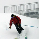 A Crystal Mountain employee tests out early season snow Monday, September 30, 2013.