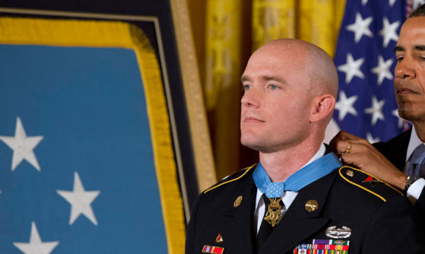 President Barack Obama awards US Army Staff Sgt. Ty M. Carter the Medal of Honor for conspicuous ga...