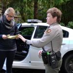Teacher Kelly Sanders gets a ticket at Olympic National Park.
