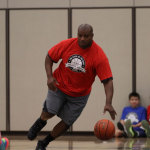 Former Seahawks player and KIRO pre- and post-game Seahawks host Mack Strong runs down the court for Team Dori.