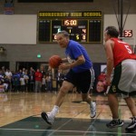 Gov. Inslee drives the ball past Dori at The Clash on the Court at Shorecrest High School Wednesday night.