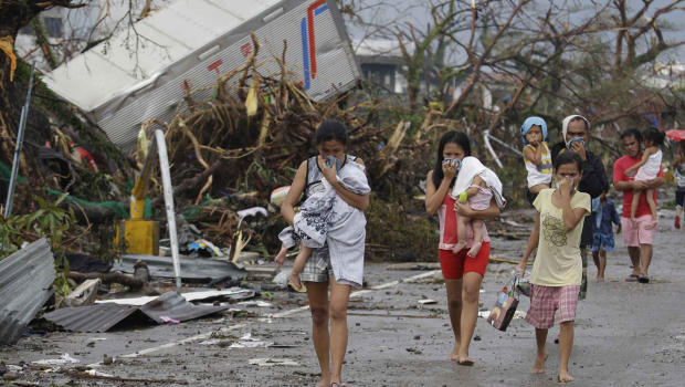 Scammers are trying to take advantage of people helping the victims of Typhoon Haiyan in the Philip...