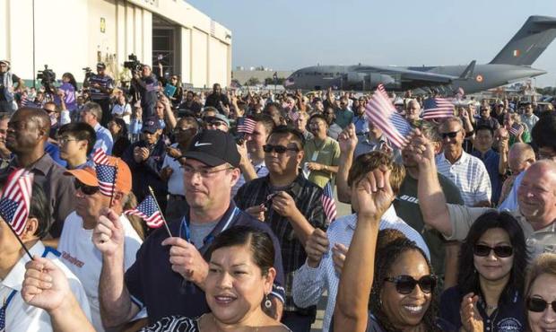Boeing Co. workers wave as they deliver the last C-17 Globemaster III cargo jet for the U.S. Air Fo...