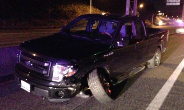 The driver’s pick-up truck is shown after a head-on collision with an SUV on NB I-5 after mid...