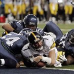 Pittsburgh Steelers quarterback Ben Roethlisberger dives in for a one-yard touchdown against the Seattle Seahawks during the second quarter of play at the Super Bowl XL football game, Sunday, Feb. 5, 2006, in Detroit.