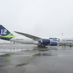 Boeing says it would take 144 747-8 passenger airplanes (Intercontinentals) to carry all the Seahawks fans in CenturyLink Field (67,000 seats).