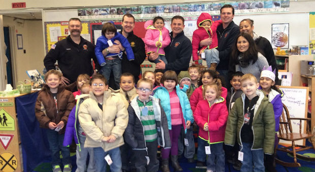 Students at Downing Elementary School are all smiles in their new winter coats thanks to Tacoma Fir...