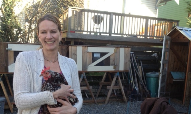 Farmstr CEO, Janelle Maiocco, holds one of the hens she raises on her urban farm in Wallingford. (P...
