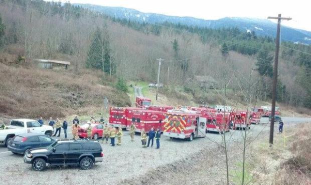 Search and rescue teams are at the mudslide near Oso looking for at least 18 people unaccounted for...