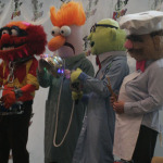 A group dressed up in Muppet costumes pose for pictures at Emerald City Comicon in Seattle, March 29, 2014.