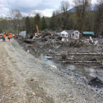 Crews have built a berm at the far eastern section of the slide area and are pumping out water from the area they wanted to search over the weekend. Two more people were recovered bringing the death toll of the March 22 slide to 41.
