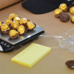 Authorities weigh some of the heroin disguised as chocolates seized in a recent sting operation.